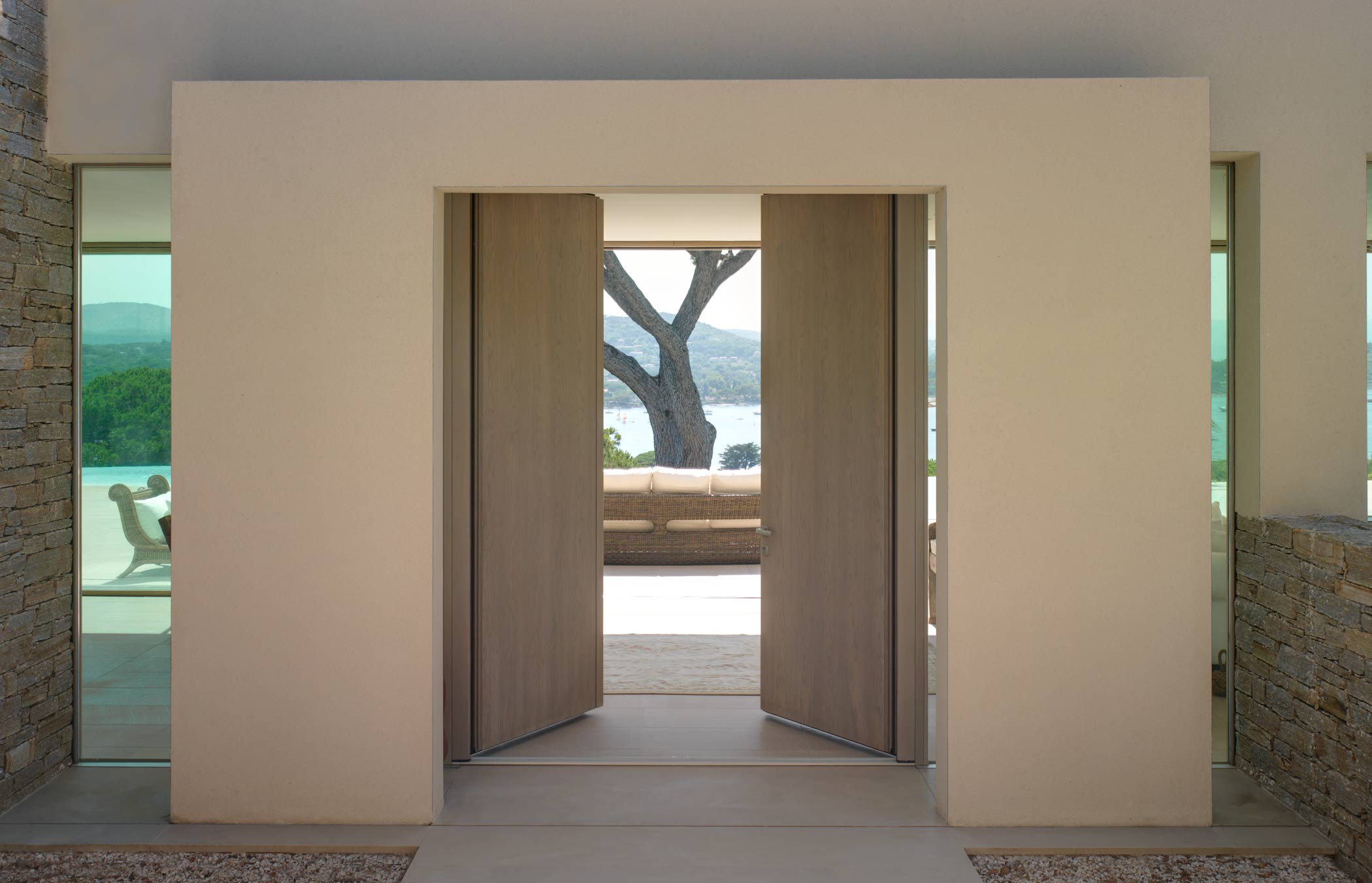 External view of a Saint Tropez model door in smooth wood