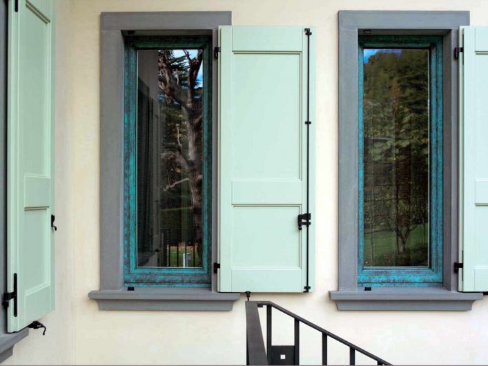 External view of the windows with lacquered wooden shutters