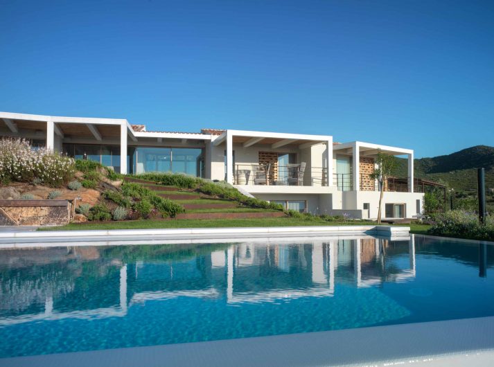 View on the wooden lift and slide doors of the main facade of Villa Costa Smeralda