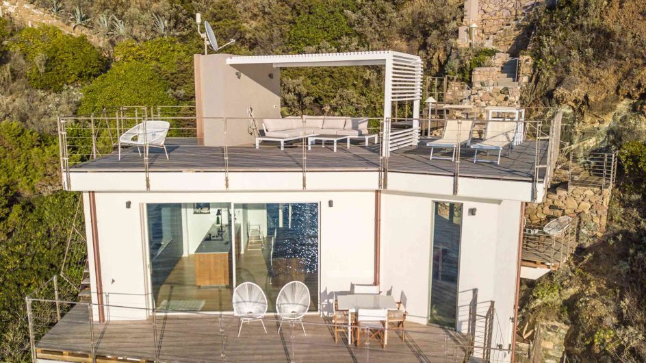 View of the elevation overlooking the sea with roof terrace, Skyline lift and slide and fixed glazing